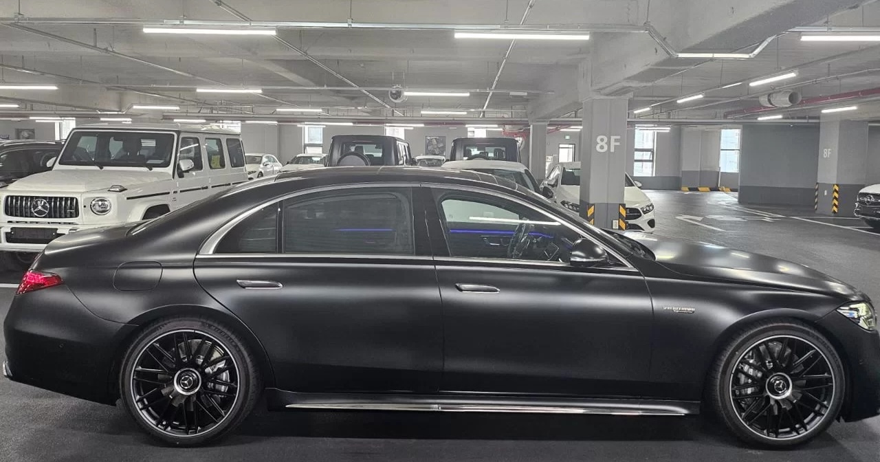 Order from Mercedes-Benz dealership with a variety of new 2024 model vehicles on display.